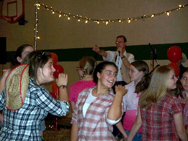 Jim McKinney calling a Square Dance